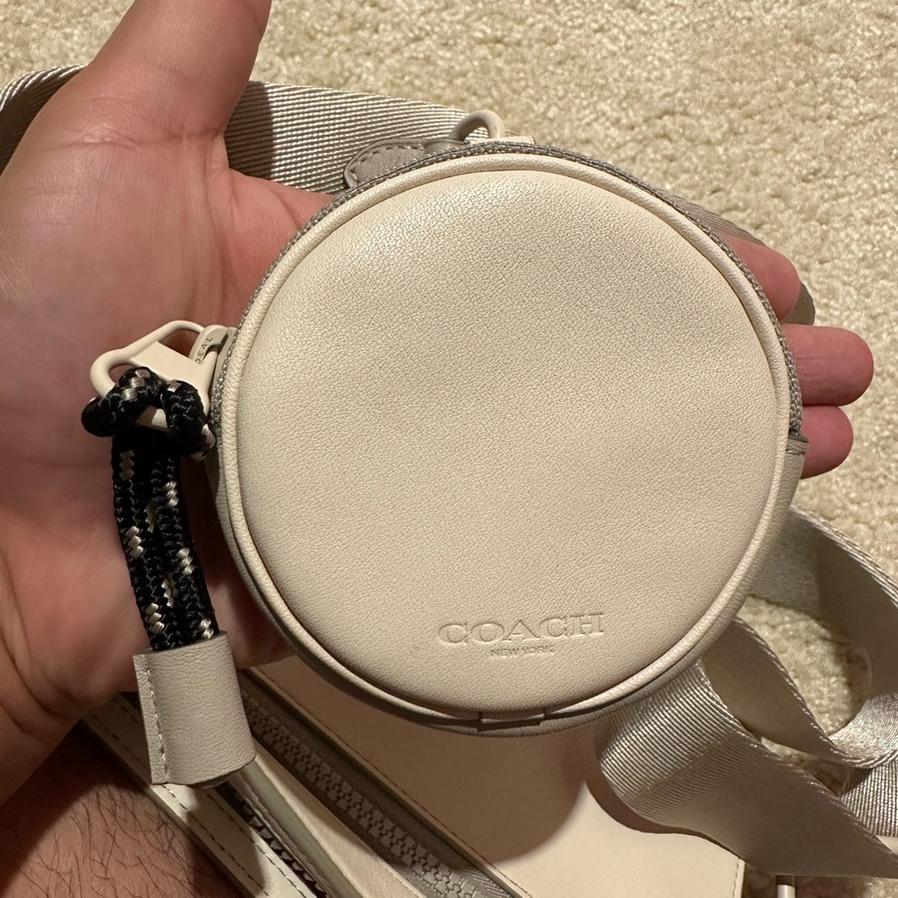 Coach Men’s Rivington Pouch 
Item # C0947
Original price $275
Color: Chalk/Bone - Picture 5 of 5